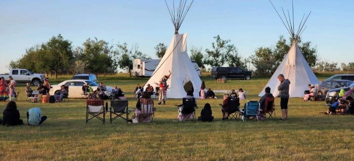 Camp participants at a mini powwow